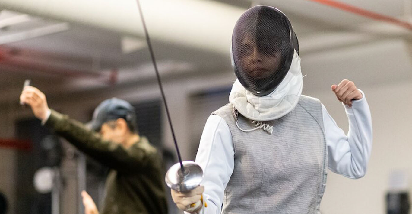 a student with her foil