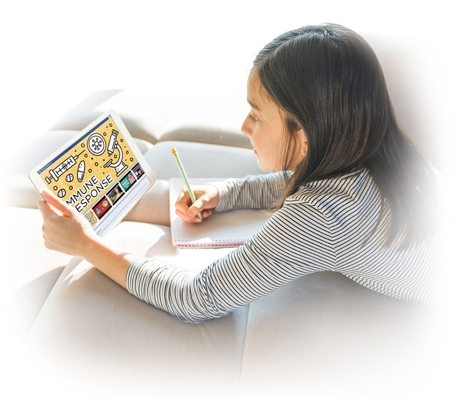 A female student is sprawled on a couch as she views her iPad which shows a title that reads 'Immune Response'. She is taking notes with pencil and paper.