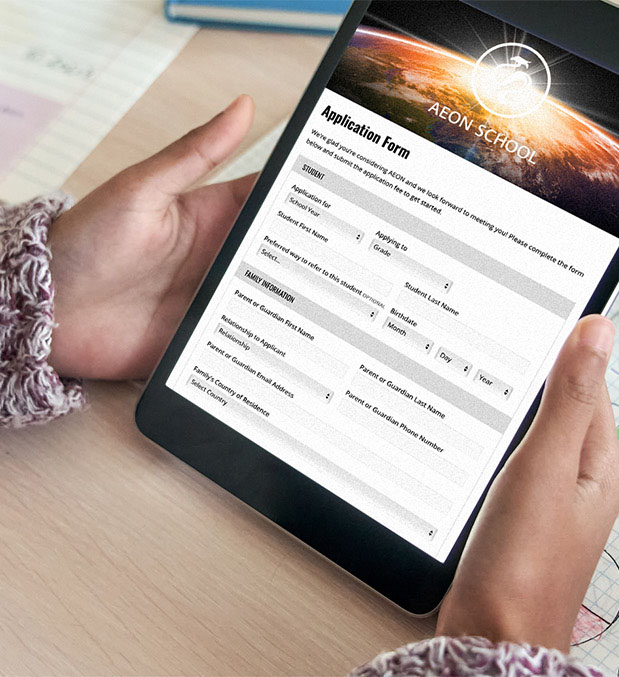 A student holds a tablet displaying the AEON School application form.