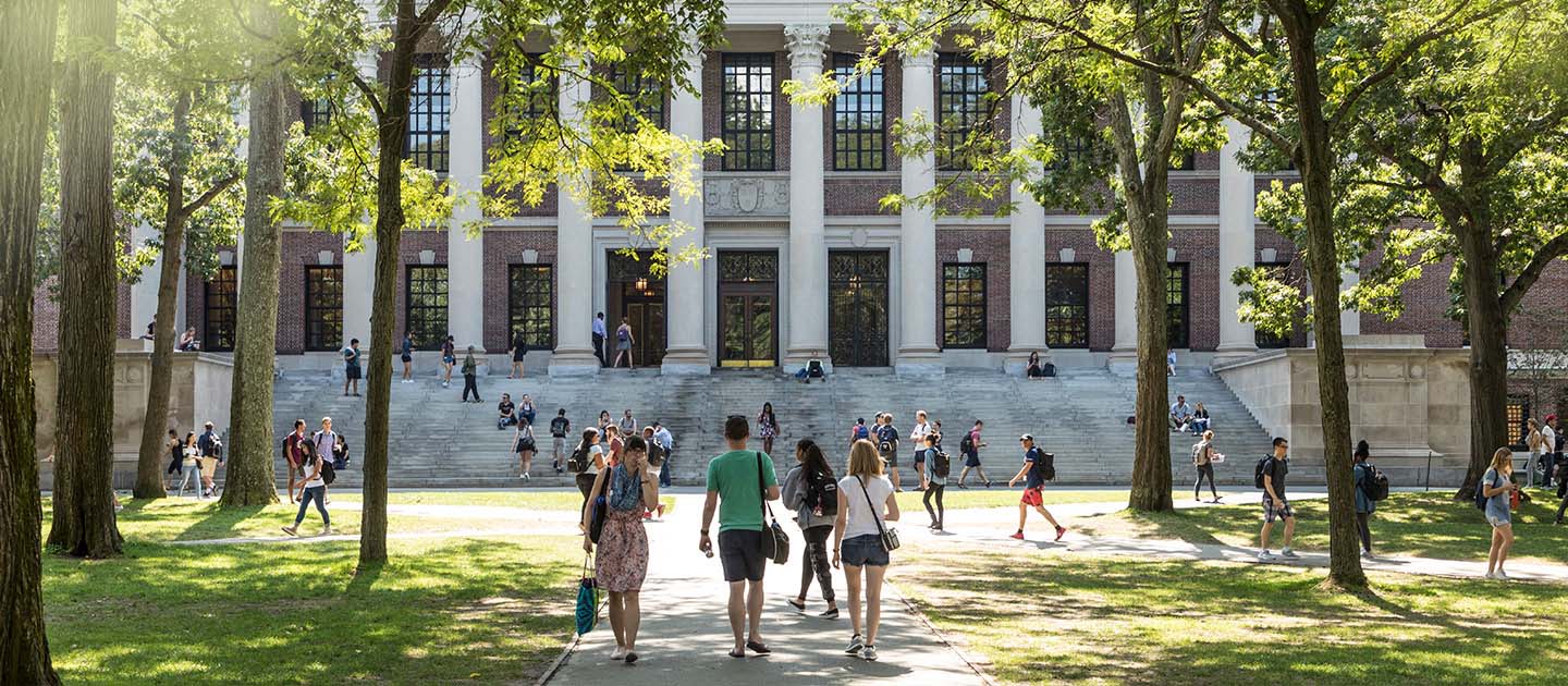 students walk into a college building