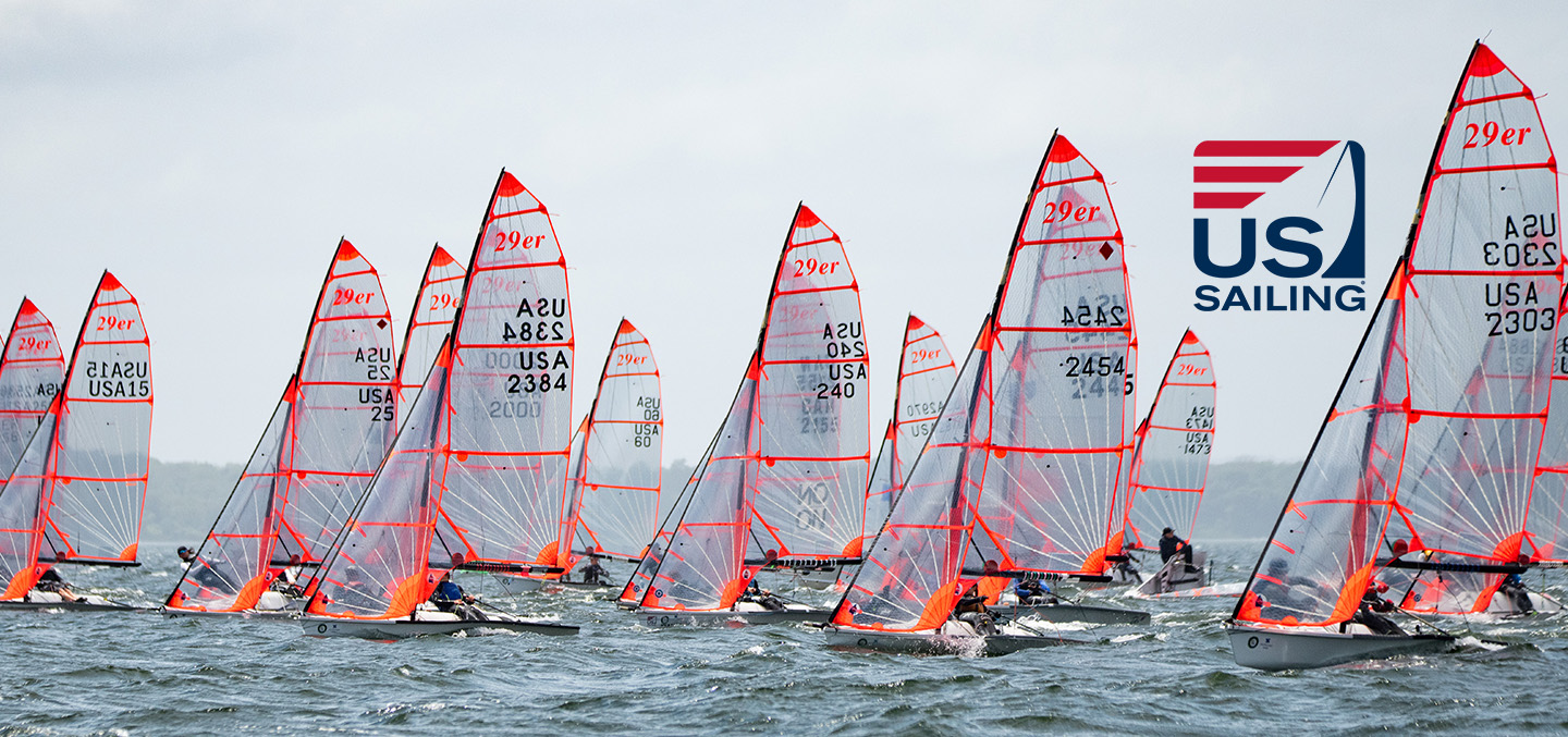 US Sailing logo over a photo of sails at the 2023 US Youth Championship